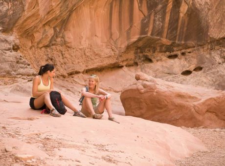 rock-climbers-relaxing-on-boulder.jpg